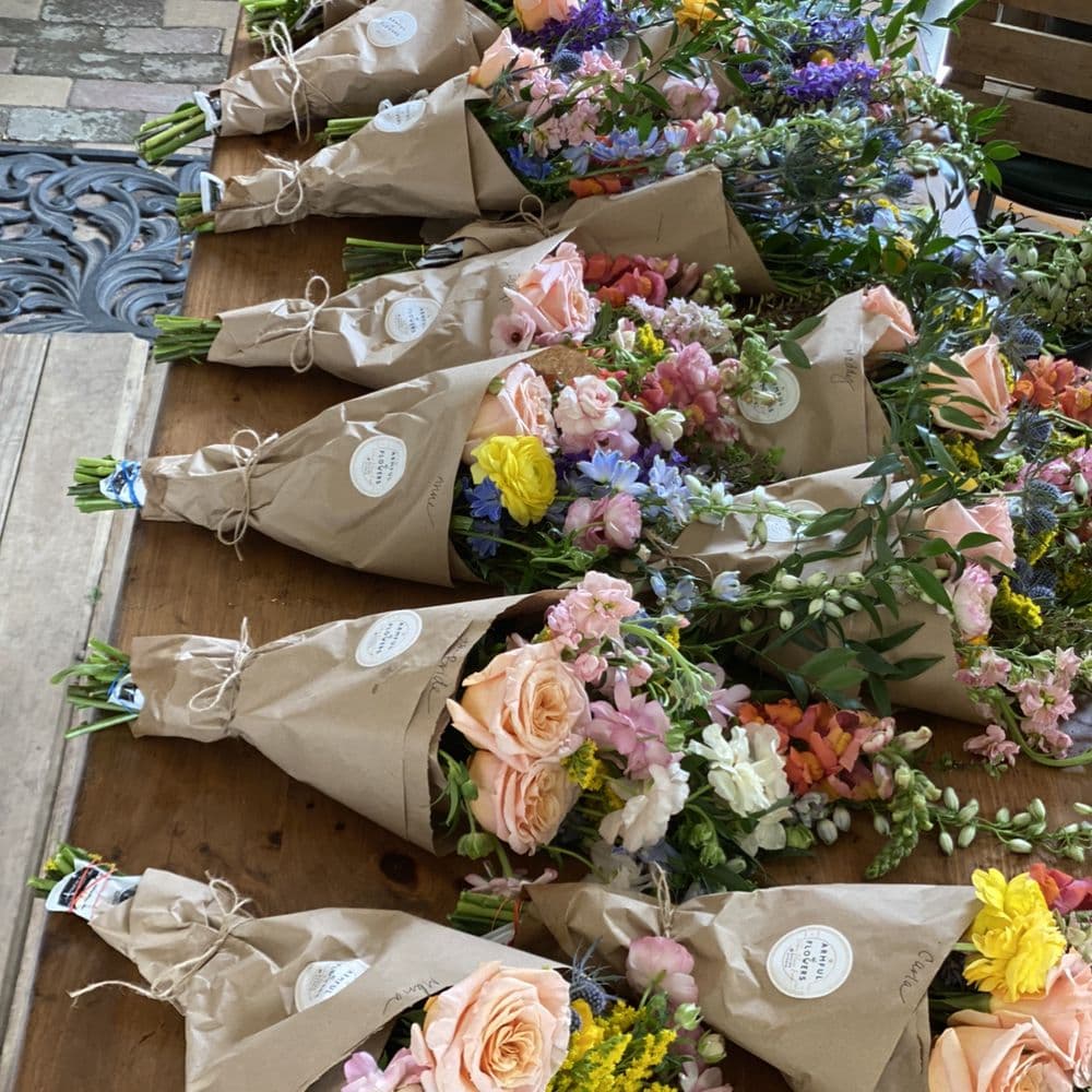 Bouquets wrapped in kraft paper, ready for delivery