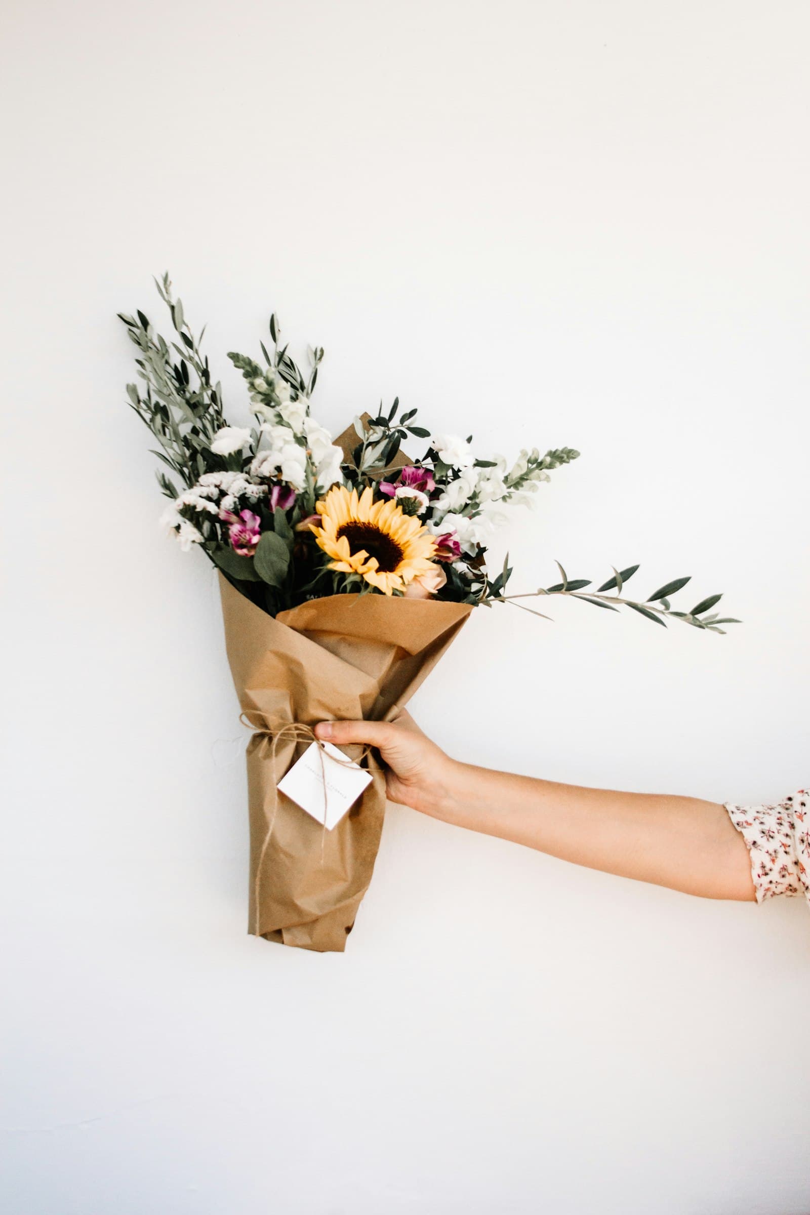 Fresh hand-tied bouquet held by the stems